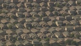 HD aerial stock footage of flying by rows of tract homes in Surprise, Arizona Aerial Stock Footage | AF0001_000836