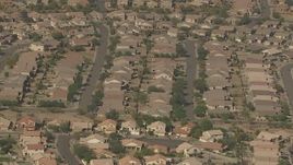 HD aerial stock footage approach and tilt to tract homes in a residential neighborhood, Surprise, Arizona Aerial Stock Footage | AF0001_000843
