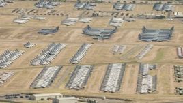 HD aerial stock footage of an aircraft boneyard with military planes at Davis Monthan AFB, Tucson, Arizona Aerial Stock Footage | AF0001_000855