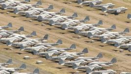 HD aerial stock footage of Air Force fighter jets at an aircraft boneyard, Davis Monthan AFB, Tucson, Arizona Aerial Stock Footage | AF0001_000856