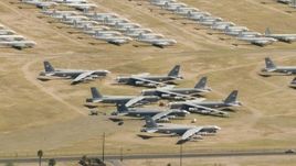 HD aerial stock footage flying by bomber jets at an aircraft boneyard, Davis Monthan AFB, Tucson, Arizona Aerial Stock Footage | AF0001_000857