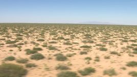 HD aerial stock footage flyby desert vegetation in a wide plain in New Mexico Aerial Stock Footage | AF0001_000903