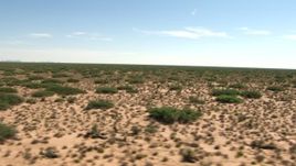 HD aerial stock footage fly low past a desert plain, New Mexico Aerial Stock Footage | AF0001_000910