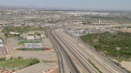 HD aerial stock footage of Bridge of the Americas and Bowie High School sports fields, El Paso/Juarez Border Aerial Stock Footage | AF0001_000933