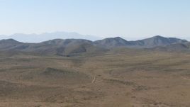 HD aerial stock footage of an arid plain and mountain ranges near El Paso, Texas Aerial Stock Footage | AF0001_000952