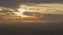 5K aerial stock footage of clouds and the setting sun over Los Angeles, California Aerial Stock Footage | AF0001_000977