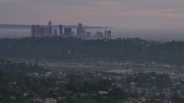 5K aerial stock footage of Downtown Los Angeles skyline seen from hillside homes at twilight, California Aerial Stock Footage | AF0001_001001
