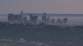 5K aerial stock footage of Downtown Los Angeles skyline behind hilltop Echo Park homes at twilight, California Aerial Stock Footage | AF0001_001002