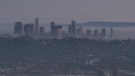 5K aerial stock footage of Downtown Los Angeles skyline behind hilltop Silver Lake homes at twilight, California Aerial Stock Footage | AF0001_001003