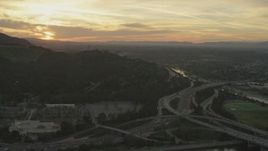 5K aerial stock footage of heavy traffic on the I-5/ 134 interchange and the Los Angeles River at sunset, Glendale, California Aerial Stock Footage | AF0001_001006