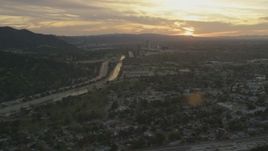 5K aerial stock footage of Los Angeles River, Highway 134, and neighborhoods at sunset, Burbank, California Aerial Stock Footage | AF0001_001008