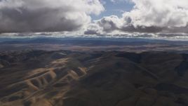 8K aerial stock footage of godrays and clouds over desert hills in Southern California Aerial Stock Footage | AF0001_001014