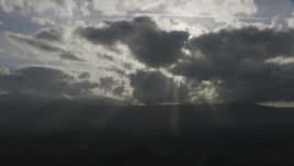 8K aerial stock footage of clouds with godrays over farm fields in Southern California Aerial Stock Footage | AF0001_001024