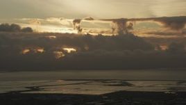 8K aerial stock footage of cloud formations over the San Mateo Bridge in San Francisco Bay at sunset in California Aerial Stock Footage | AF0001_001034
