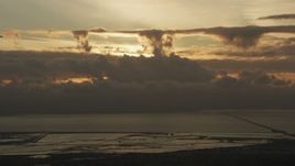 8K aerial stock footage of cloud formations over San Francisco Bay and San Mateo Bridge at sunset in California Aerial Stock Footage | AF0001_001035