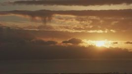 8K aerial stock footage setting sun dipping behind clouds formations in Northern California Aerial Stock Footage | AF0001_001039