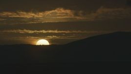 8K aerial stock footage of the setting sun behind a mountain ridge in Northern California Aerial Stock Footage | AF0001_001044