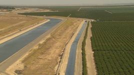 1080 aerial stock footage flyby aqueduct, fields of crops Central Valley, California Aerial Stock Footage | AI06_FRM_010