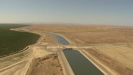 1080 aerial stock footage approaching an irrigation canal, crops, open fields, Central Valley, California Aerial Stock Footage | AI06_FRM_059