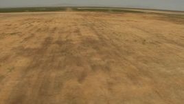1080 aerial stock footage flying by open fields, Central Valley, California Aerial Stock Footage | AI06_FRM_107