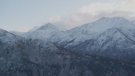4K aerial stock footage flying by snow covered Chugach Mountains, Chickaloon, Alaska Aerial Stock Footage | AK0001_0001