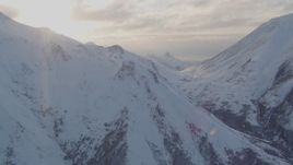 4K aerial stock footage pan left by snow covered Chugach Mountains, Chugach National Forest, Alaska Aerial Stock Footage | AK0001_0004