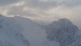 4K aerial stock footage snow-covered Chugach Mountains, clouds, Chugach National Forest, Alaska Aerial Stock Footage | AK0001_0007