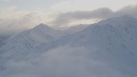 4K aerial stock footage flying by snow covered Chugach Mountain peaks, Chugach National Forest, Alaska Aerial Stock Footage | AK0001_0015