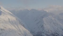 4K aerial stock footage flying by snow covered Chugach Mountain peaks, Chugach National Forest, Alaska Aerial Stock Footage | AK0001_0016