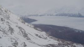 4K aerial stock footage pan right by Knik Glacier and Chugach Mountains, Knik Glacier, Alaska Aerial Stock Footage | AK0001_0023