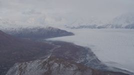 4K aerial stock footage pan right by Knick Glacier, bordered by Chugach Mountains, Knik Glacier, Alaska Aerial Stock Footage | AK0001_0025