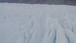 4K aerial stock footage flying low over Knik Glacier, revealing Chugach Mountains, Knik Glacier, Alaska Aerial Stock Footage | AK0001_0029