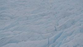 4K aerial stock footage flying over surface of the Knik Glacier, tilt up, Knik Glacier, Alaska Aerial Stock Footage | AK0001_0032