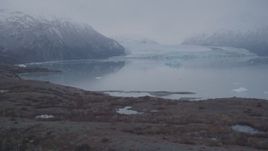 4K aerial stock footage approaching Inner Lake George and a glacier, flying low, Inner Lake George, Alaska Aerial Stock Footage | AK0001_0038