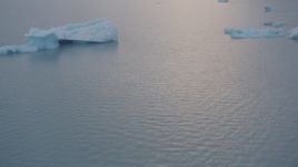 4K aerial stock footage flying low over the lake surface, approaching icebergs, Inner Lake George, Alaska Aerial Stock Footage | AK0001_0042