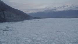 4K aerial stock footage flying low over surface of a glacier, revealing ice covered lake, Knik, Alaska Aerial Stock Footage | AK0001_0054