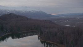 4K aerial stock footage over foothills, reveal lake, valley, Chugach Mountains, Knik River Valley, Alaska Aerial Stock Footage | AK0001_0064