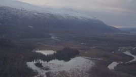 4K aerial stock footage fly by rivers, Chugach Mountains, tilt down to small lake, Knik River Valley, Alaska Aerial Stock Footage | AK0001_0066