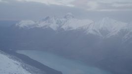 4K aerial stock footage flying by Chugach Mountains and Eklutna Lake, Alaska Aerial Stock Footage | AK0001_0074