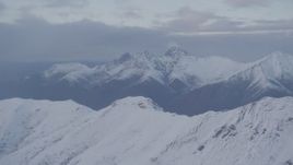 4K aerial stock footage snow capped Chugach Mountains, clouds, Chugach Mountains, Alaska, sunset Aerial Stock Footage | AK0001_0077