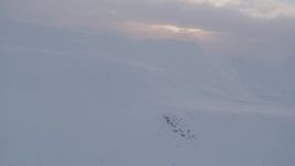 4K aerial stock footage snow covered mountains, clouds, Chugach Mountains, Alaska, sunset Aerial Stock Footage | AK0001_0079