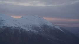 4K aerial stock footage flyby by snow capped mountain peak, Chugach Mountains, Alaska, sunset Aerial Stock Footage | AK0001_0088