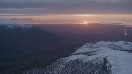 4K aerial stock footage pan left by Anchorage, seen from Chugach Mountains, Alaska, sunset Aerial Stock Footage | AK0001_0093