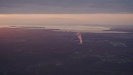 4K aerial stock footage approaching Anchorage and a power plant, Alaska, sunset Aerial Stock Footage | AK0001_0096