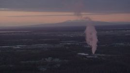 4K aerial stock footage flyby power plant, zoom to reveal Downtown Anchorage, Alaska, sunset Aerial Stock Footage | AK0001_0100
