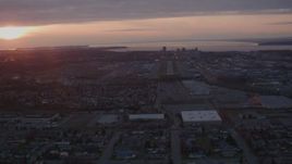 4K aerial stock footage approaching Merrill Field and Downtown Anchorage, Alaska, sunset Aerial Stock Footage | AK0001_0104