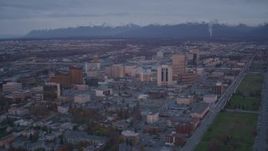 4K aerial stock footage orbit Downtown, Chugach Mountains, Downtown Anchorage, Alaska, twilight Aerial Stock Footage | AK0001_0108