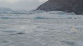 4K aerial stock footage flying low over the icy Knik River, approaching Knik Glacier, Alaska Aerial Stock Footage | AK0001_0115