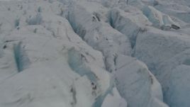 4K aerial stock footage flying low over surface of Knik Glacier, tilt up, Knik Glacier, Alaska Aerial Stock Footage | AK0001_0141
