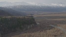 4K aerial stock footage flying over valley at base of Chugach Mountains, pan left, Knik River Valley, Alaska Aerial Stock Footage | AK0001_0148